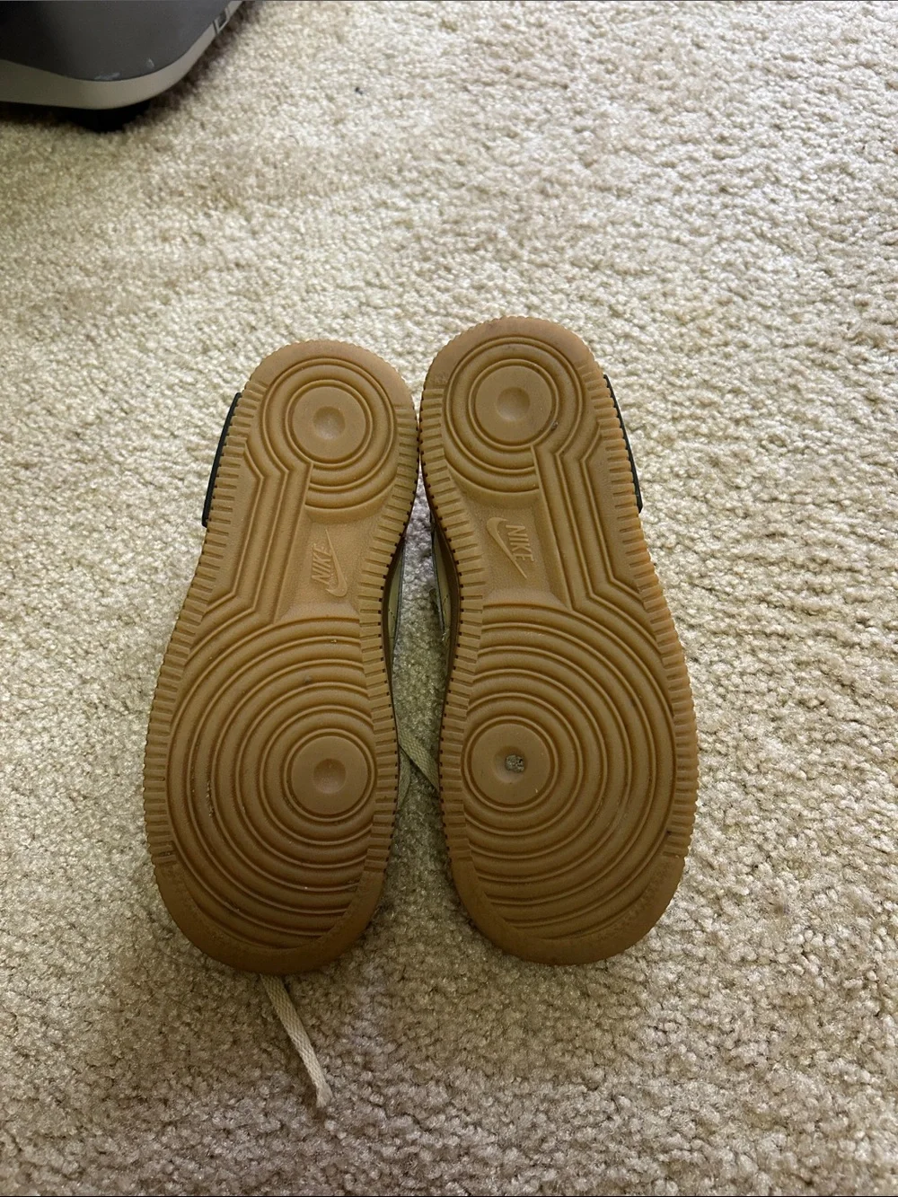 Nike Kids beige/tan sneakers.